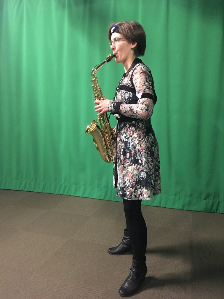 Professional saxophone player Kelsey Broersma showing sensor placement.